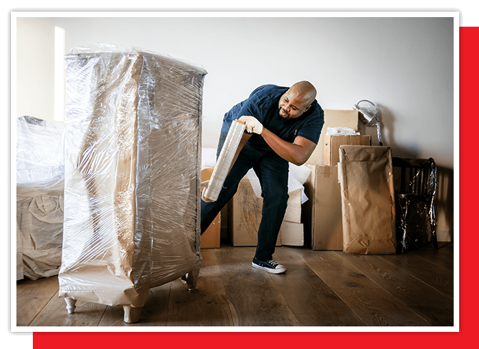 image of a mover packing up a dresser